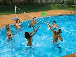 An indoor swimming pool is pretty straightforward—it's inside, under a roof, and insulated by at least three walls. Amazon Com Poolmaster Across In Ground Swimming Pool Volleyball Pool Game Toys Games