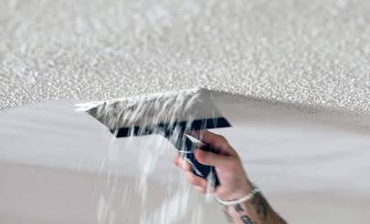Textured popcorn ceiling before removal in a North Vancouver living room