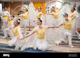 IMAGE DISTRIBUTED FOR TAI JI MEN QIGONG ACADEMY - Youth members of the Tai  Ji Men Qigong Academy dressed as angels present an elegant dance titled  