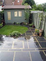 Create the perfect outdoor space for a small and tiny garden with these small garden ideas, from design to landscaping to planting to furniture. Good Colour For Garden Shed Slate Paving Slate Paving London Garden Tiny Garden Ideas Small Gardens