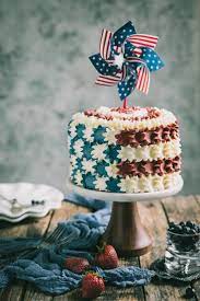 Celebrate Memorial Day With A Strawberry Blueberry Layer Flag Cake This Vanilla Layer Poke Cake Is Filled With R Flag Cake Holiday Cakes Moist Vanilla Cake