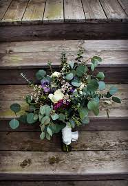 Bohemian Vintage And Rustic Styled Fresh Stem Bouquet Using Eucalyptus Seeded Eucalyptus Silver Dollar Euca Wax Flowers Ivory Roses Silver Dollar Eucalyptus