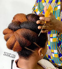 A loose braid ending in a bun is a fresh new take on a simple cornrow style. 40 Elegant Natural Hair Updos For Black Women Coils And Glory