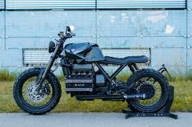 A café racer bike is a lightweight, powerful motorcycle optimised for speed and handling rather than comfort. Bmw S K100 Bike Gets Even More Edgy With A F 117 Nighthawk Aircraft Inspired Redesign Yanko Design