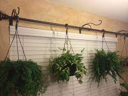 expand your hanging plant capabilities use some hangers and a curtain rod simple to put up plants indoor wall etsy baskets