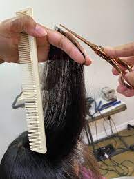 Part off a section of hair using a rat tail comb, part off a small section of dried, straighten hair. The Do S And Don Ts On Trimming Your Natural Hair Talk Curly To Me