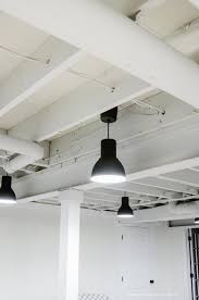 Our Painted Basement Ceiling White Why We Love It Basement Lighting Basement Ceiling Basement Remodeling