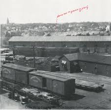 Looking NW from the Northern Pacific shops, date unknown. Notice the red  words....Material in the cars of the train