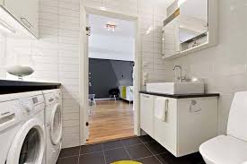 The floor and wall cabinets in this room have recessed panels and the wall cabinets have grown why not have a combination bathroom and laundry center? Moving Company Quotes Tips To Plan Your Move Mymove Laundry Room Bathroom Laundry In Bathroom Laundry Bathroom Combo