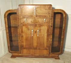 One side of this unique cabinet can be turned 360 degrees to either display your bar's inventory or store it more discreetly. Art Deco Odeon Stylish Walnut Cocktail Cabinet Antiques Atlas