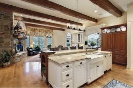 The kitchen cabinets in this log cabin use a dark raw tone finish which contributes to the rugged look of the room. 24 Rustic Kitchen Cabinet Ideas For 2021