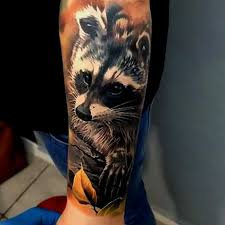 Raccoon Tattoo On His Arm Man Raccoon Tattoo Bear Tattoos Tattoo Designs Men