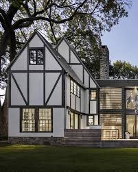 These ranch & tudor home designs are unique and have customization options. Business In The Front Party In The Back 5 Traditional Homes That Got Super Modern Additions Tudor House Exterior Traditional Home Exteriors German House