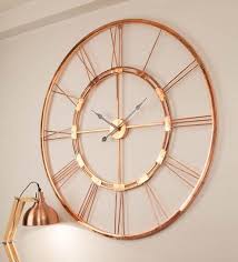 The walls clock when you buy must be something that must complement the wall and. Buy Copper Finish Metal 30 Inch Wall Clock By Craftter Online Vintage Wall Clocks Wall Clocks Home Decor Pepperfry Product Wall Clock Copper Vintage Wall Clock Wall Clock