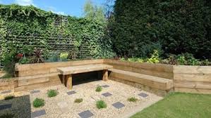 Railway sleepers are a timeless garden edging option. Corner Sleeper Bed Bench Sleepers In Garden Railway Sleepers Garden Garden Design