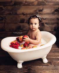 If your baby seems frightened of bathing and cries, try bathing together. Baby Girl Bath Photo Shoot With Apples And Roses Baby Milk Bath Milk Bath Photos Milk Bath Photography