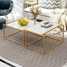 The surfaces are made of wood and showcase a gray finish. Simple Living Room Table Sets Nesting Coffee Tables Marble Look Sofa Side Tables Telescopic End Tables With Gold Metal Frame Home Decor Sets White Set Of 2 Buy Online In United Arab Emirates