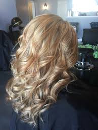 This is a lighter take on caramel blonde that sees warm, rich highlights combine with a golden blonde base, creating a gloriously glowy mane that appears lit from within. White Blonde Highlighted With Warm Caramel And Coffee Accents Lowlights Highlights Color Curls Aloxxi Kreatio Blonde Hair Color Hair Color Highlights Hair