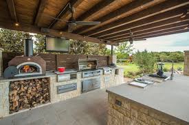 Maximize your backyard year round with an outdoor kitchen. Pool Entertainment Area With Gourmet Kitchen And Pizza Oven Diy Outdoor Kitchen Patio Kitchen Modern Outdoor Kitchen