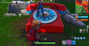 The holographic durr burger sign is located at neo titled. Fortnite Week 8 Challenge Dial The Durr Burger Number On The Big Telephone Digital Trends