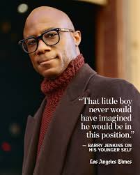 The young boy looked sharp, decked out in an orange-brown suit. His warm  smile gave