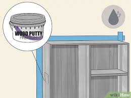 If your cabinets are stained, apply at least two coats of a quality primer. How To Refinish Particle Board Cabinets With Pictures Wikihow