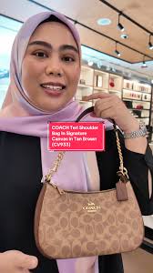 Exploring the Coach Swing Zip Signature Canvas Shoulder Bag