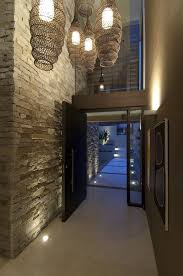 Front Entrance And Hallway In A House In Sydney Australia Featuring A Stone Wall And Some Very Cool V House Entrance House Design Interior Architecture Design