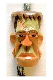 Hand-carved bolo ties by Bill Burch and Gary Dollar