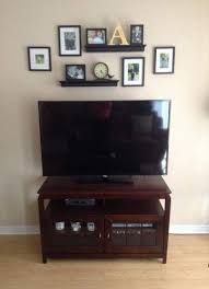 Installing a shelf (or several) significantly improves the storage situation in any bathroom, even those notoriously cramped city apartments. Best Farmhouse Living Room Wall Decor Over Tv Ideas Wall Decor Above Tv Decor Above Tv Tv Wall Decor