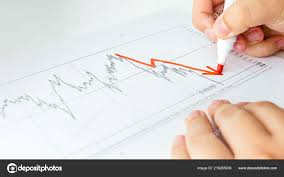 Closeup Image Of Business Analyst Drawing Decreasing Graph