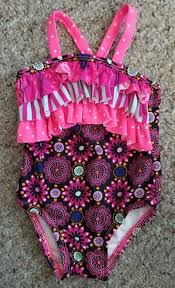 Spending the day in the pool or by the lake is a great way for the whole family to have fun. Circo Pink Floral Print Ruffled One Piece And 13 Similar Items