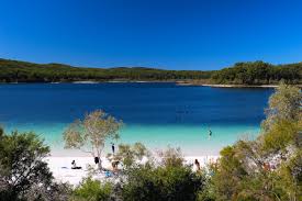 Fraser island is a large sand island 122 km (76 miles) long (the largest sand island in the world) situated off the southern coast of the australian state of queensland, some 300 km (200 miles) north of the state capital brisbane. Lake Mckenzie Wikipedia