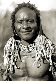 A man from Emo village, Papua, with hair braids and extensions,  photographed in 1921 by Frank Hurley. National Library of Australia.