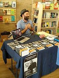 A book signing is an event, usually at a bookstore or library where an author sits and signs books for a period of time. Book Signing Wikipedia