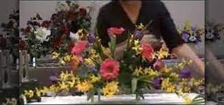 Headstone saddles are designed to clamp on the the top of the stone and hold your arrangement in place, but it really doesn't take much wind to blow it away. How To Make A Monument Saddle Arrangement Flower Arrangement Wonderhowto
