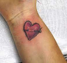 Stiched Heart Tattoo On Wrist Broken Heart Tattoo Heart Tattoo Designs Heart Tattoo