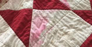 Color bleed occurs when the fabric gets wet, and dye leaches out of the fibers. Reverse A Color Bleed With This Easy Tip Quilting Digest Remove Color Bleeding Cleaning Hacks Quilts