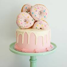 karla goodwin on instagram donut doughnut whatever you call them they look pretty awesome on this cake doughnutcake donutcake backen essen