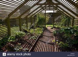 Stock Photo Wooden Slated Plant Shade House Garden England Shade House Garden Design Pergola Shade