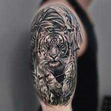 The 12 Best Half Sleeve Tattoos Tiger Tattoo Designs Petpress Half Sleeve Tattoos Tiger Tiger Tattoo Design Tiger Tattoo