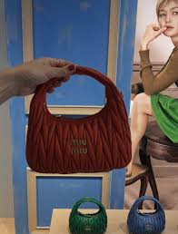 Miu Miu bag of SUMMER 🤍✨ She's playful, iconic, and made for golden hour  moments. The perfect mix of cute and statement — summer officially has a  main character. 👜☀️ #miumiu #summerbag #itgirlaccessory #luxurystyle