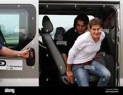 Swiss nationals Olivier David Och, and Daniela Widmer, front, leave a car  after landing at Zurich airport, Saturday March 17, 2012. The Swiss Foreign  Ministry says the couple that were held captive
