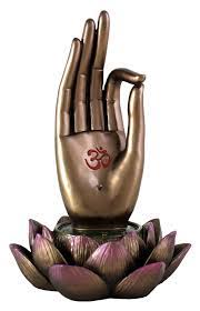 Interlace fingers of both hands, extending one thumb upwards, encircle extended thumb with the index finger and thumb of your other hand. Top Collection Buddha Hand And Lotus Flower Vitarka Mudra Incense Holder Incense Burner Buy Online In Qatar At Qatar Desertcart Com Productid 36235516