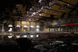Inside the garage, there is illuminated ceiling, expensive cars parked in an organized manner and batman paraphernalia. In Gowanus Batcave Broken Teenage Dreams Live On Abandonednyc