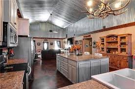 Corrugated Tin Dominates This Remarkable Kitchen In A Small Barndominium Lake House Kitchen Small Cabin Kitchens Barndominium
