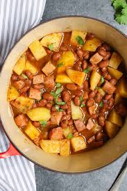 It's flavorful and great with pork chops when tender add tomato sauce ,the sazon seasoning and adobo, pimento olive and the 2 cans of pink beans or small red beans stir put in the rice and chicken bouillon and chicken. Puerto Rican Rice And Beans Habichuelas Guisadas Tipbuzz