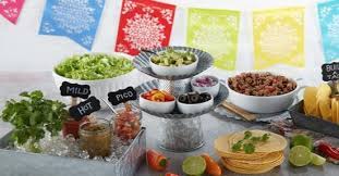 We did a taco bar at my sons graduation party last year & it was great!. Kroger