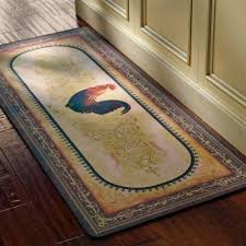 Designs of kitchen rugs may coordinate with lines of other kitchen linens, or range from classic to modern, including many seasonal creations. Victory Rooster Mat Frontgate