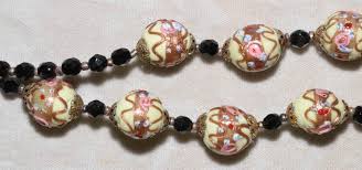 Check spelling or type a new query. Sold Price Vintage Italian Made Double Strand Wedding Cake Beaded Necklace In Gold Tone W Black Crystal Accents And Slide Clasp Includes 26 Three Dimensional Hand Shaped Wedding Cake Beads January 6